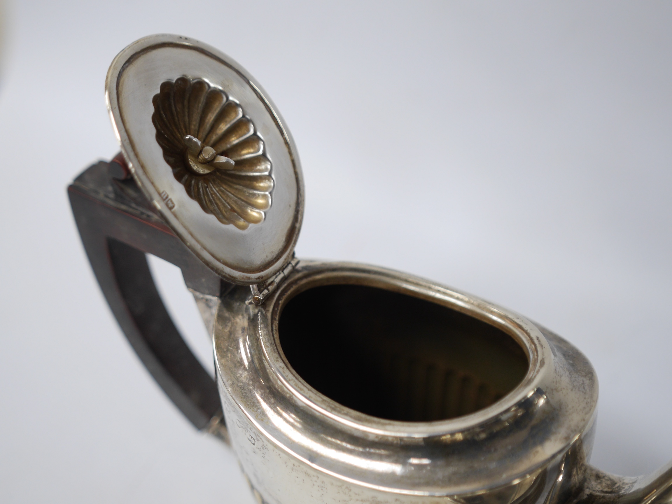 A late Victorian bachelor's demi-fluted silver teapot, Birmingham, 1894, together with a George V silver two handled bowl by Hukin & Heath, gross weight 11.3oz. Condition - fair